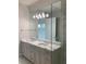 Double vanity bathroom with a large mirror and modern finishes at 4819 Higel Rd, Sarasota, FL 34242