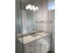 Modern bathroom with white cabinets and a quartz countertop at 4819 Higel Rd, Sarasota, FL 34242