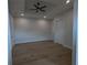 Bright bedroom featuring hardwood floors and high ceilings at 4819 Higel Rd, Sarasota, FL 34242