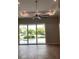 Bright living room with sliding glass doors leading to the patio and water views at 4819 Higel Rd, Sarasota, FL 34242