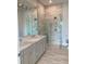 Elegant bathroom with double vanity and large walk-in shower at 4819 Higel Rd, Sarasota, FL 34242