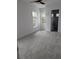 Spacious bedroom with plush carpeting and ceiling fan at 4819 Higel Rd, Sarasota, FL 34242