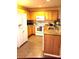 Galley kitchen with wood cabinets and granite counters at 2607 River Preserve Ct # 2607, Bradenton, FL 34208