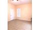Well-lit bedroom featuring tile floors and a window with blinds at 2607 River Preserve Ct # 2607, Bradenton, FL 34208