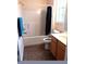 Bathroom with tub, toilet and vanity with wood cabinets at 2607 River Preserve Ct # 2607, Bradenton, FL 34208