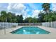 Community pool with surrounding patio furniture at 2607 River Preserve Ct # 2607, Bradenton, FL 34208