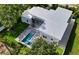 Aerial view showcasing a modern home with a pool and backyard patio at 2231 Wood St, Sarasota, FL 34237