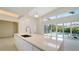 Modern kitchen with white cabinetry and expansive windows at 2231 Wood St, Sarasota, FL 34237