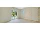 Bright bedroom with sliding glass doors to backyard at 2231 Wood St, Sarasota, FL 34237