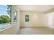 Bright bedroom with large windows and tile flooring at 2231 Wood St, Sarasota, FL 34237