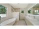 Spa-like bathroom with freestanding tub and marble accents at 2231 Wood St, Sarasota, FL 34237