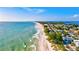 Expansive beachfront property with ocean waves and homes at 780 Tarawitt Dr, Longboat Key, FL 34228