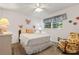 Cozy bedroom with double bed, armchair, and ample natural light at 780 Tarawitt Dr, Longboat Key, FL 34228