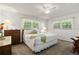 Spacious main bedroom with king-size bed and ample natural light at 780 Tarawitt Dr, Longboat Key, FL 34228