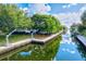 Lovely waterfront home with private dock and lush landscaping at 780 Tarawitt Dr, Longboat Key, FL 34228