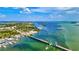 Aerial view of a drawbridge over calm waters with boats at 780 Tarawitt Dr, Longboat Key, FL 34228