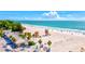 Expansive beach with lifeguard towers and volleyball courts at 780 Tarawitt Dr, Longboat Key, FL 34228