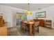 Charming dining room with table and chairs, adjacent to the kitchen at 780 Tarawitt Dr, Longboat Key, FL 34228
