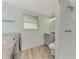 Bathroom with shower, toilet and washer/dryer hookups at 2900 Siesta Dr, Venice, FL 34293