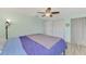 Main bedroom with gray blanket and blue bedding at 2900 Siesta Dr, Venice, FL 34293
