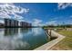 Peaceful waterfront view with a dock and condo buildings at 2900 Siesta Dr, Venice, FL 34293