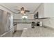 Updated kitchen with white cabinets and granite countertops at 2900 Siesta Dr, Venice, FL 34293