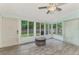 Sunroom with ample natural light and view of backyard at 2900 Siesta Dr, Venice, FL 34293