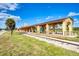Historic train depot with covered platform and landscaping at 2900 Siesta Dr, Venice, FL 34293