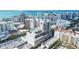 Aerial view of building showcasing rooftop amenities and city skyline at 50 Central Ave # 17Phb, Sarasota, FL 34236