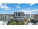 Daytime aerial view of condo building in a vibrant city location with surrounding building at 50 Central Ave # 17Phb, Sarasota, FL 34236