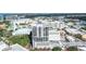 Aerial view of Insula Buchanan with city views, showing balconies, rooftop pool, and the building's design at 50 Central Ave # 17Phb, Sarasota, FL 34236
