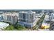 Stunning aerial view of the condo building surrounded by lush landscaping and city streets at 50 Central Ave # 17Phb, Sarasota, FL 34236