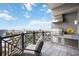 Outdoor balcony featuring built-in grill area, tile flooring, and city views at 50 Central Ave # 17Phb, Sarasota, FL 34236