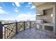 Private balcony features stainless steel grill, tile backsplash, and tile flooring, perfect for outdoor cooking at 50 Central Ave # 17Phb, Sarasota, FL 34236