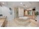 Luxurious bathroom with a soaking tub, glass-enclosed shower, and custom vanity with ample storage at 50 Central Ave # 17Phb, Sarasota, FL 34236