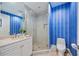 Stylish bathroom features a glass-enclosed shower and vanity with sink at 50 Central Ave # 17Phb, Sarasota, FL 34236
