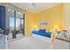 Bright bedroom with a daybed, balcony access and cheerful decor at 50 Central Ave # 17Phb, Sarasota, FL 34236