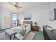 Cozy bedroom offers bright natural light, relaxing decor, and city view at 50 Central Ave # 17Phb, Sarasota, FL 34236