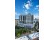 Exterior daytime view of the building and surrounding city with blue skies and lush landscaping at 50 Central Ave # 17Phb, Sarasota, FL 34236