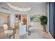 Chic dining room with a glass table, modern lighting, and stylish decor at 50 Central Ave # 17Phb, Sarasota, FL 34236