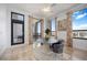 Light-filled dining area with city views, balcony access and stylish accents at 50 Central Ave # 17Phb, Sarasota, FL 34236