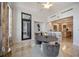 Open dining area with breakfast bar, balcony access, and sleek chairs at 50 Central Ave # 17Phb, Sarasota, FL 34236