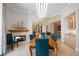 Luxurious dining room showcasing travertine floors, fireplace, and seamless transition to living spaces at 50 Central Ave # 17Phb, Sarasota, FL 34236