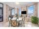 Cozy dining area with large windows, city views, and stylish furnishings at 50 Central Ave # 17Phb, Sarasota, FL 34236
