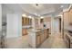 Bright kitchen showcases wood cabinets, stainless appliances, and stylish island at 50 Central Ave # 17Phb, Sarasota, FL 34236