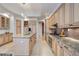 Spacious kitchen features custom wood cabinets, stainless appliances, and granite countertops at 50 Central Ave # 17Phb, Sarasota, FL 34236