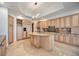 Elegant kitchen features custom cabinets, built-in refrigerator, and a spacious island at 50 Central Ave # 17Phb, Sarasota, FL 34236