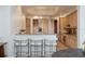 Open kitchen with bar seating, stainless steel appliances, and custom cabinetry at 50 Central Ave # 17Phb, Sarasota, FL 34236