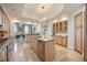 Open-concept kitchen features modern cabinets, a central island, and ample lighting at 50 Central Ave # 17Phb, Sarasota, FL 34236