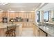 Spacious kitchen with granite countertops, stainless steel appliances, and ample cabinet space at 50 Central Ave # 17Phb, Sarasota, FL 34236